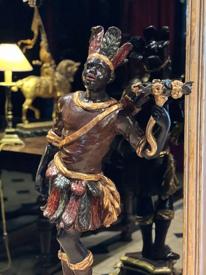 Pair of polychrome and gilded carved wood...