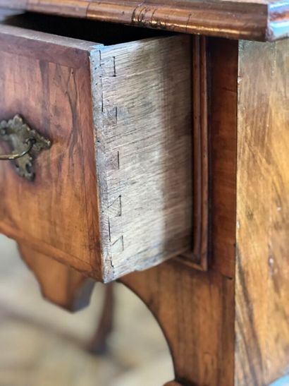 Wood veneer table-top opening to three drawers...