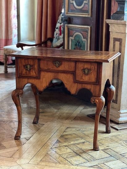 Wood veneer table-top opening to three drawers...