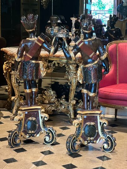 Pair of polychrome and gilded carved wood...