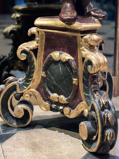 Pair of polychrome and gilded carved wood...