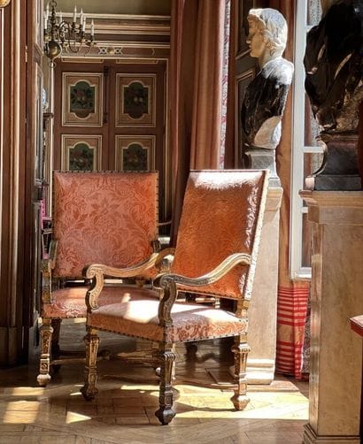 Pair of large armchairs in richly carved,...