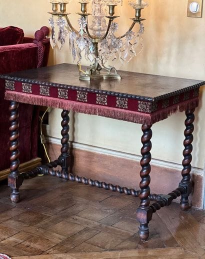 Carved natural wood table, resting on four...