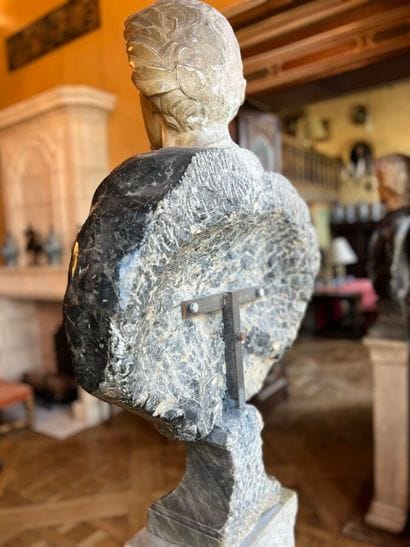 Bust on pedestal carved in white and gray...