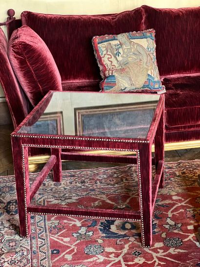 Wooden end table covered with purple velvet....
