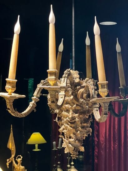 Pair of three-light bronze sconces adorned...