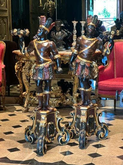 Pair of polychrome and gilded carved wood...