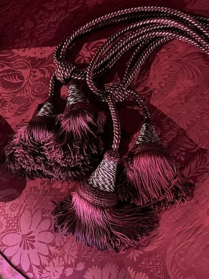 Pair of tassel tiebacks in red fabric (some...
