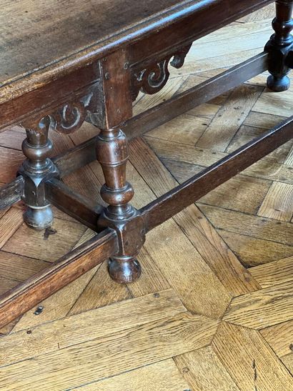 Natural wood bench decorated with carved...