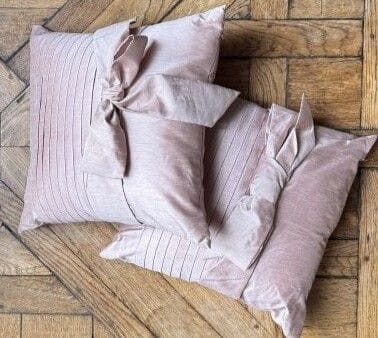 Pair of cushions with pink fabric bow in...