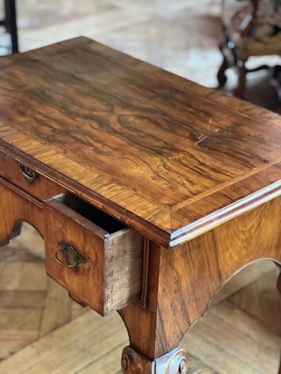 Wood veneer table-top opening to three drawers...