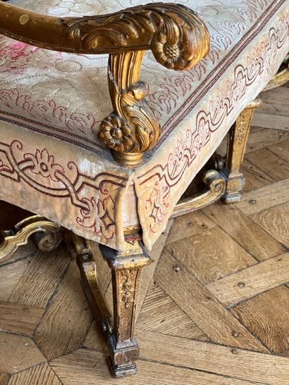 Carved and gilded wooden sofa, decorated...