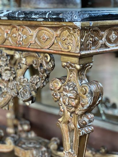 A gilded and varnished wood game console...