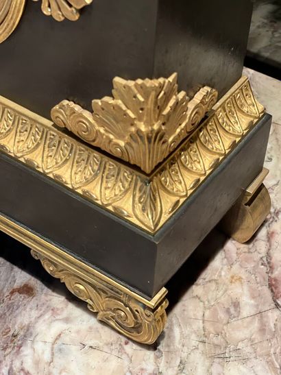 Patinated and gilded bronze clock decorated...