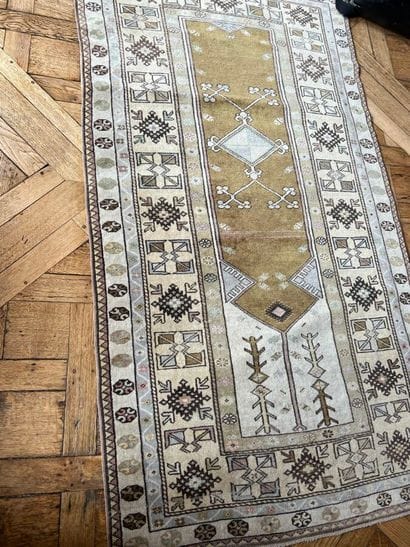 Oriental rug with beige and water-green background,...