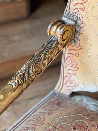 Carved and gilded wooden sofa, decorated...