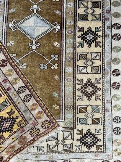 Oriental rug with beige and water-green background,...