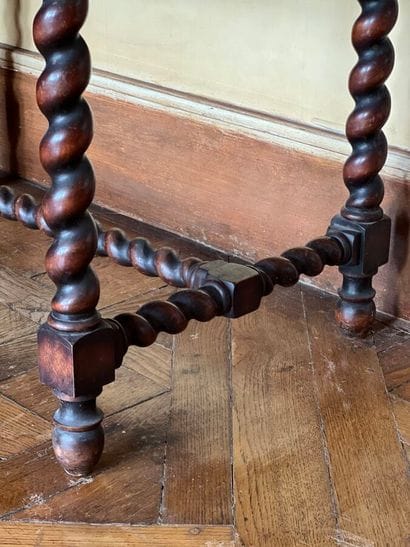 Carved natural wood table, resting on four...