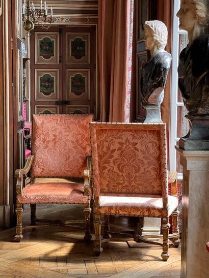 Pair of large armchairs in richly carved,...