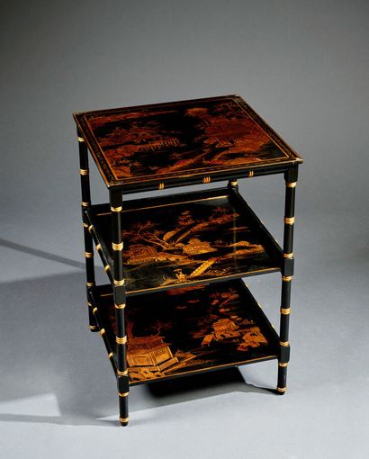 Black and gold pedestal table, forming the...