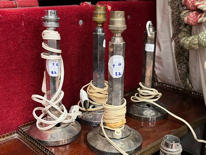 Suite of four silver-plated metal lamps,...