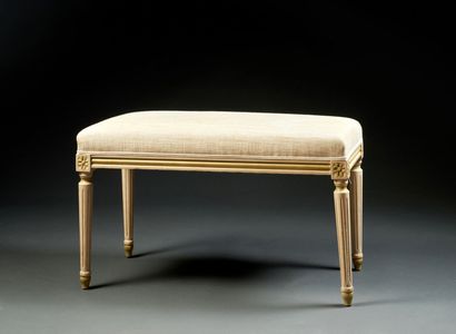 White lacquered molded wood bench in the...