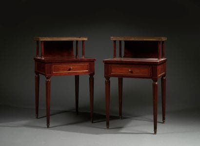 Pair of tiered bedside tables adorned with...