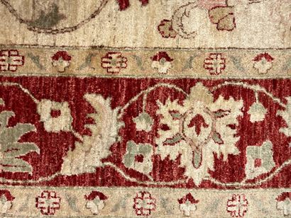 Beige carpet decorated with stylized foliage.
355...