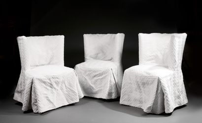 Three armchairs with semi-circular backs,...