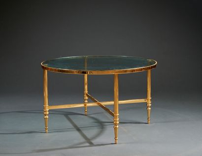 Round pedestal table in gilded metal, with...