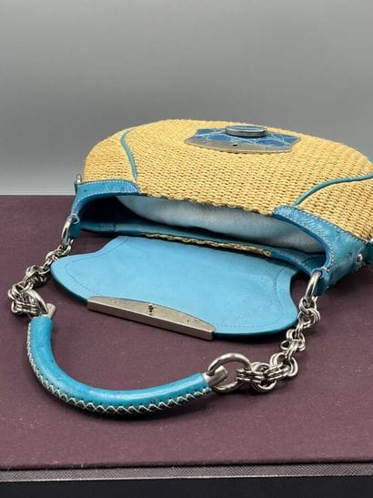 PRADA Milano - Baguette paglia mix.

The...