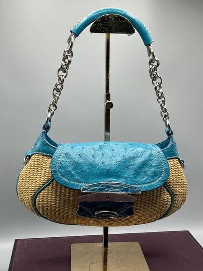 PRADA Milano - Baguette paglia mix.

The...