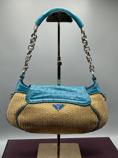 PRADA Milano - Baguette paglia mix.

The...