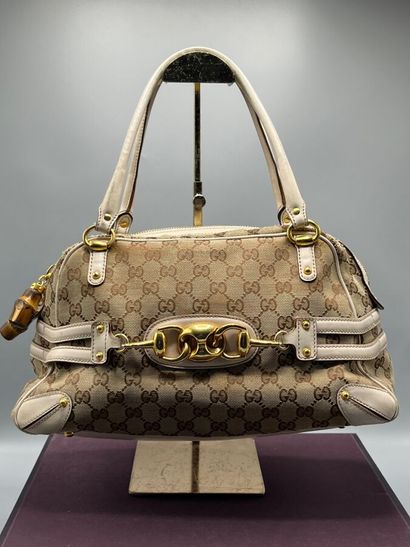 GUCCI - GG supreme bit canvas handbag.

Made...