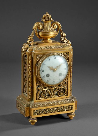 Chased ormolu clock with foliage scrolls...