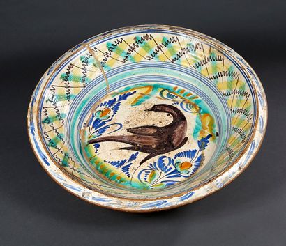 Large earthenware dish with polychrome decoration...