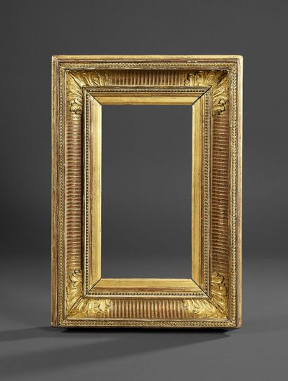 Frame in molded wood and gilded stucco, decorated...