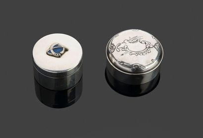 Two small covered circular boxes in silver...