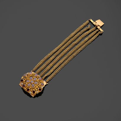 Gilt metal bracelet with five chains, the...