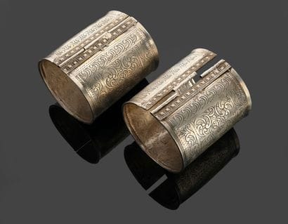 Pair of silver bracelets decorated with stylized...