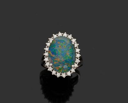 White gold ring set with an opal doublet...