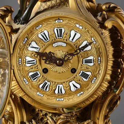 Large Rococo-style clock in chased and gilded...