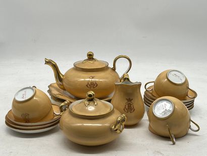 Part of a tea service in orange-yellow porcelain,...