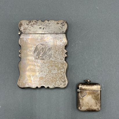 Curved silver cardholder centered with an...