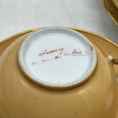 Part of a tea service in orange-yellow porcelain,...
