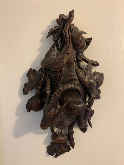 Pair of trophies in carved wood. Black Forest...