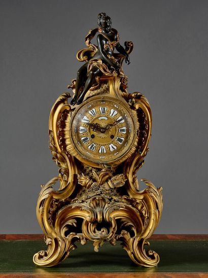 Large Rococo-style clock in chased and gilded...