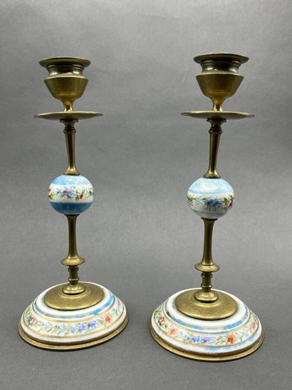 Pair of brass and polychrome porcelain candlesticks...
