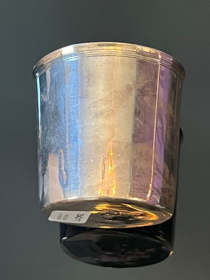 Silver tumbler monogrammed MC.131. The lip...