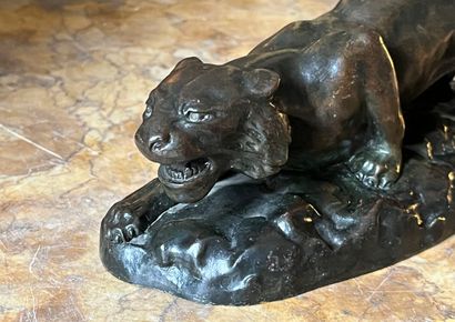 Brown patina bronze sculpture of a panther...